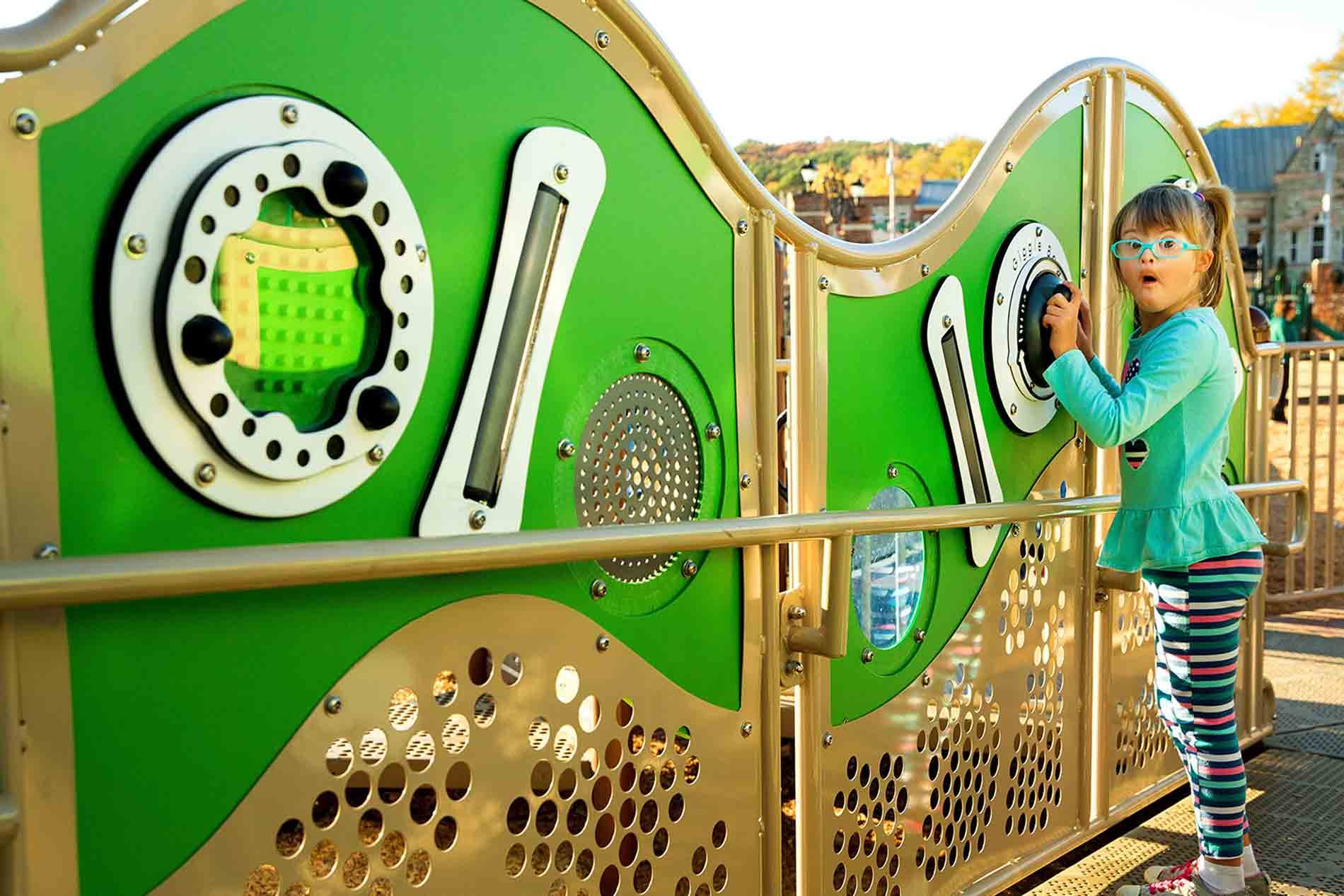 kid playing with sensory panels