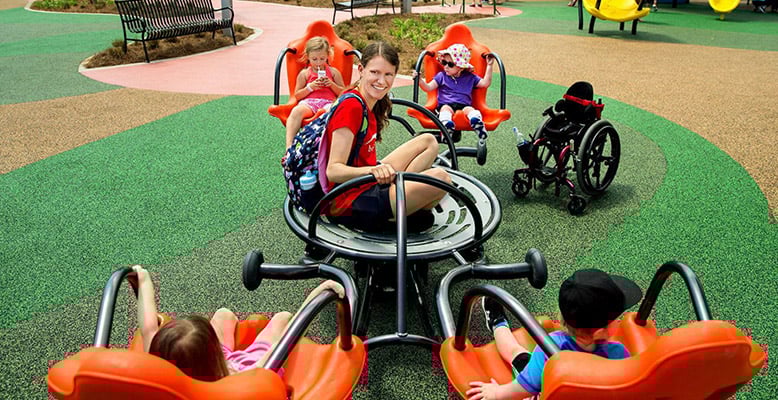 Parent playing with her children