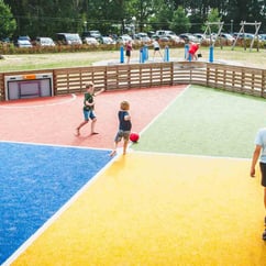 Kids playing on the four goal Toro court